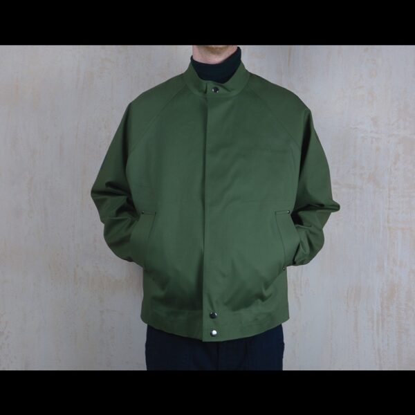 Front-View-Of-Model-Wearing-Waterproof-Green-Rain-Jacket-By-Rainford-Apparel