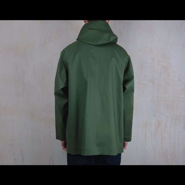 Back-View-Of-Model-Wearing-Waterproof-Green-Rain-Parka-By-Rainford-Apparel