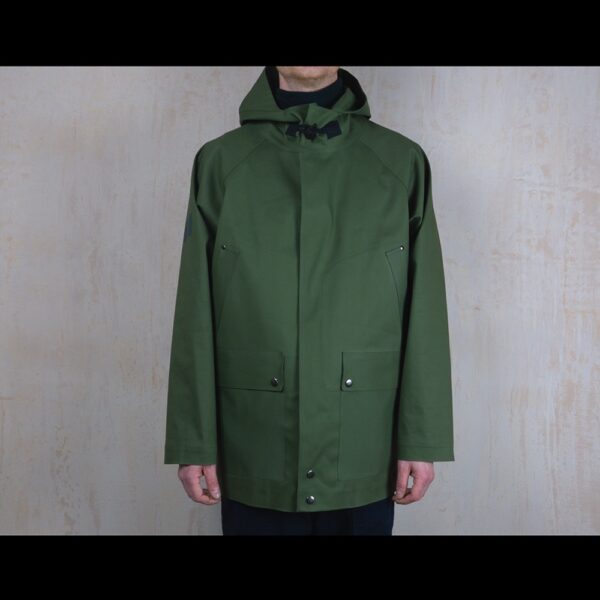 Front-View-Of-Model-Wearing-Waterproof-Green-Rain-Parka-By-Rainford-Apparel