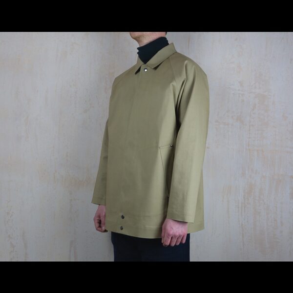 Side-View-Of-Model-Wearing-Waterproof-Caramac-Raincoat-By-Rainford-Apparel