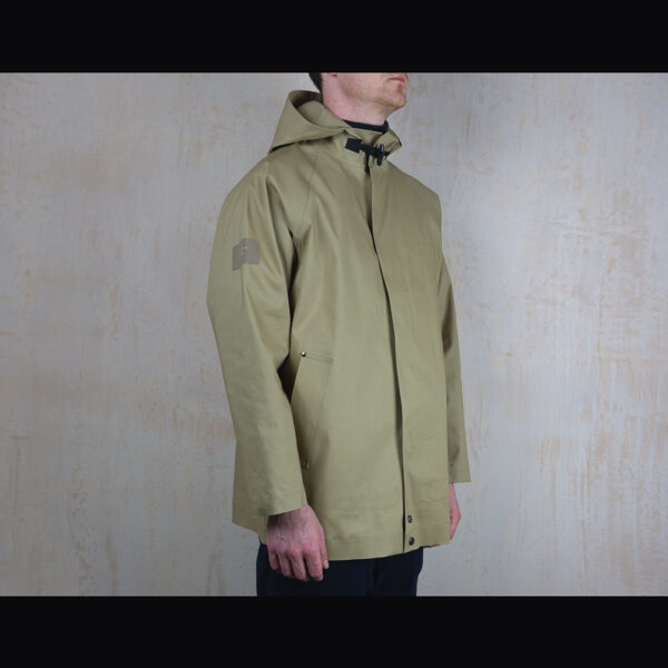 Logo-Side-View-Of-Model-Wearing-Waterproof-Caramac-Rain-Anorak-By-Rainford-Apparel