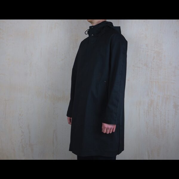Side-View-Of-Model-Wearing-Waterproof-Rain-Parka-By-Rainford-Apparel